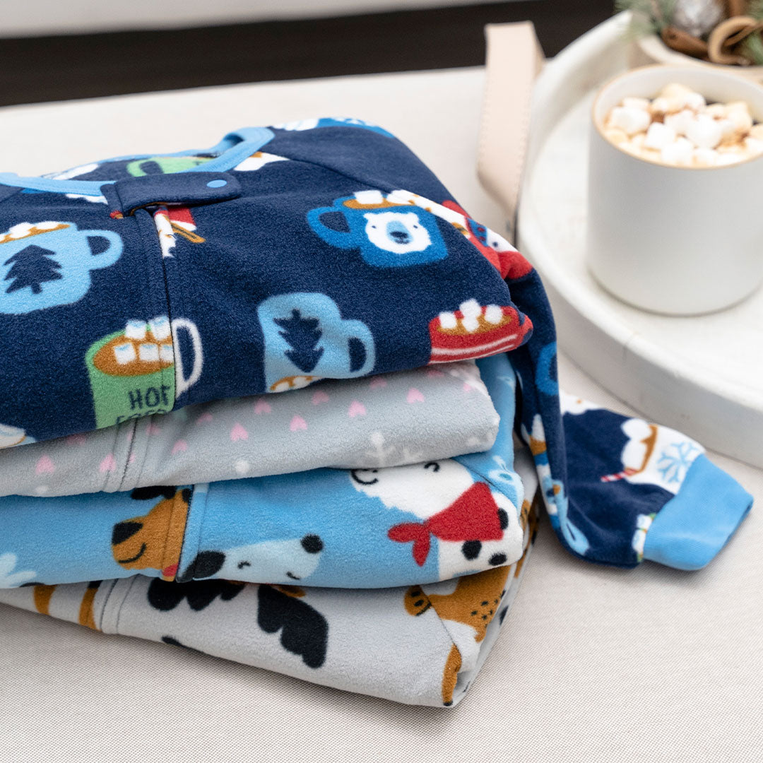Cozy winter essentials: blankets, coco, and a mug. Perfect for snuggling up in boys' pajamas with a cup of hot cocoa!