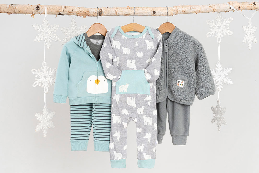 Dress your little one in the cutest winter outfit featuring penguins, polar bears, and stripes - complete with pajamas, a hoodie.